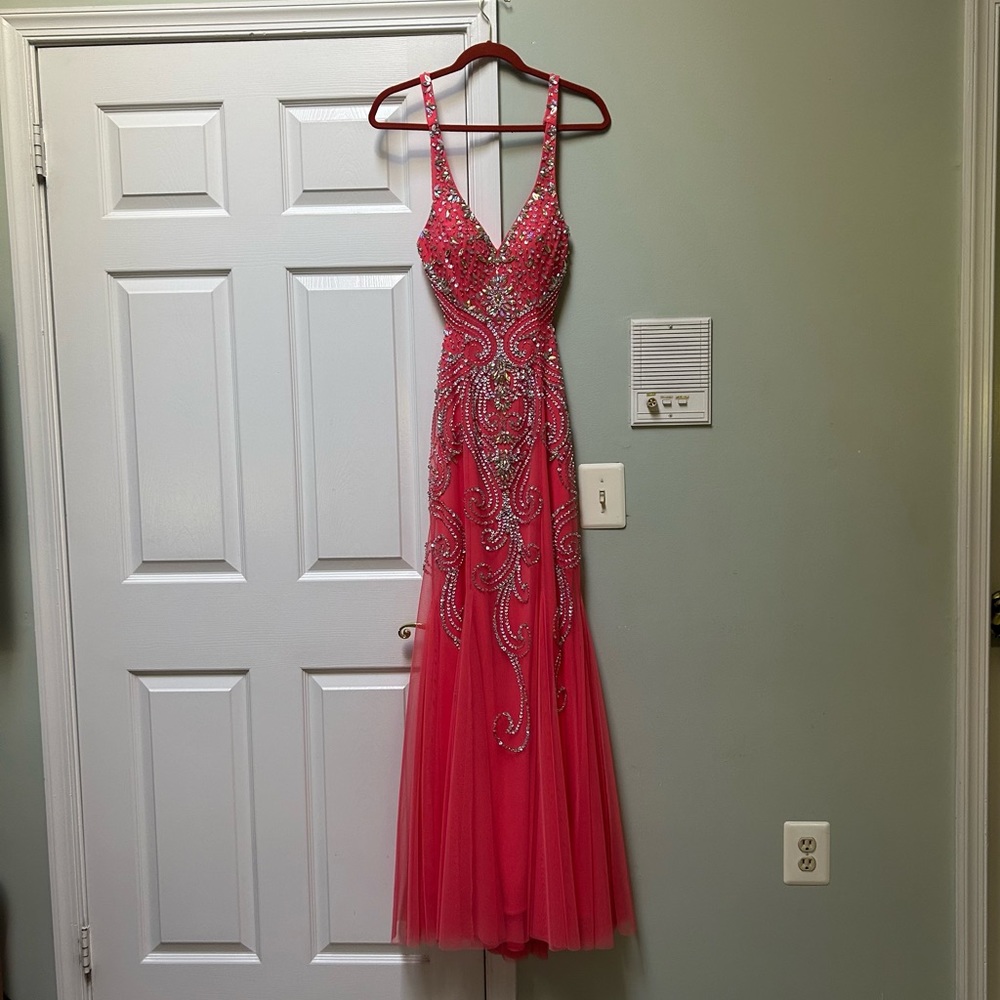A coral, backless and mesh prom (mermaid style) glitterati dress, worn once